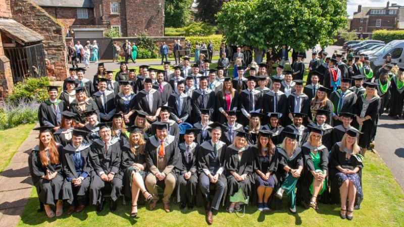 Group of graduates wearing graduation gowns and caps