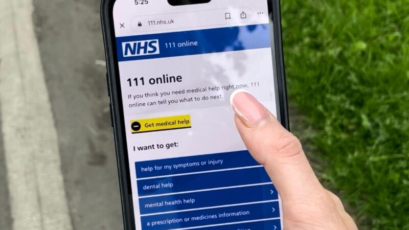 A mobile phone showing NHS 111 online webpage