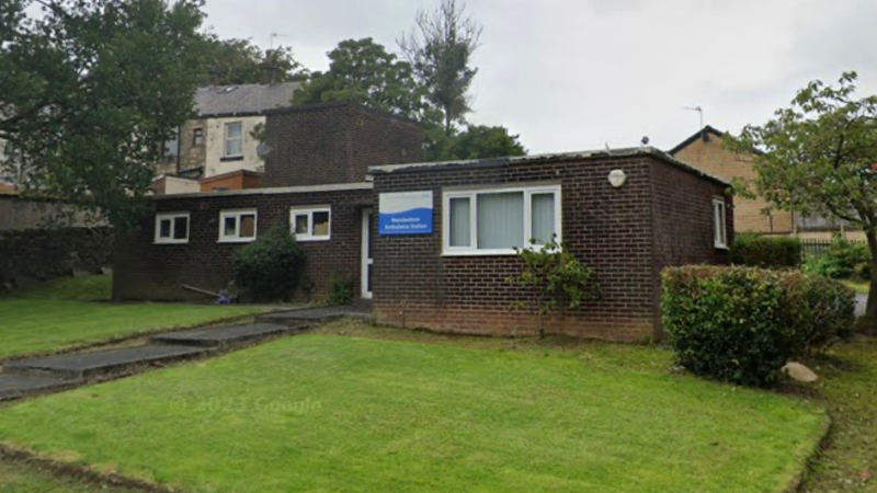 Ramsbottom Ambulance Station: A small, one-story building with old brick walls and a flat roof, located in a residential area with a grass lawn in front of it.