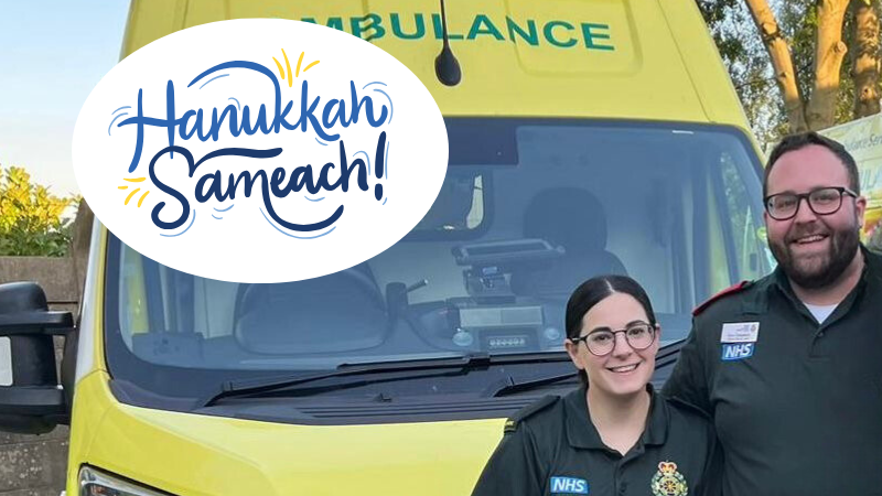 Two paramedics standing in front of an ambulance with a "Hanukkah Sameach!" greeting across the image.